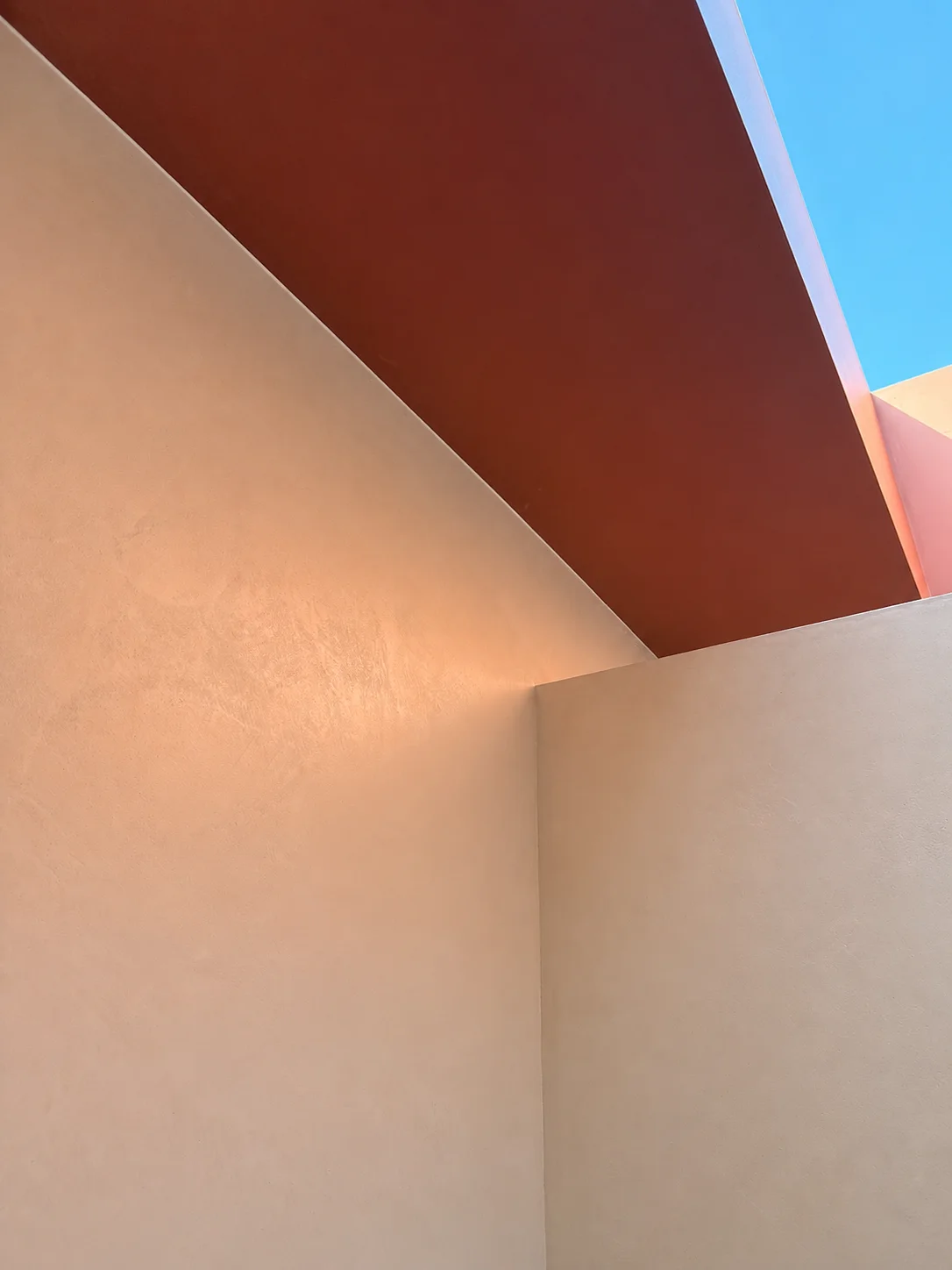 Completed textured wall beneath a skylight